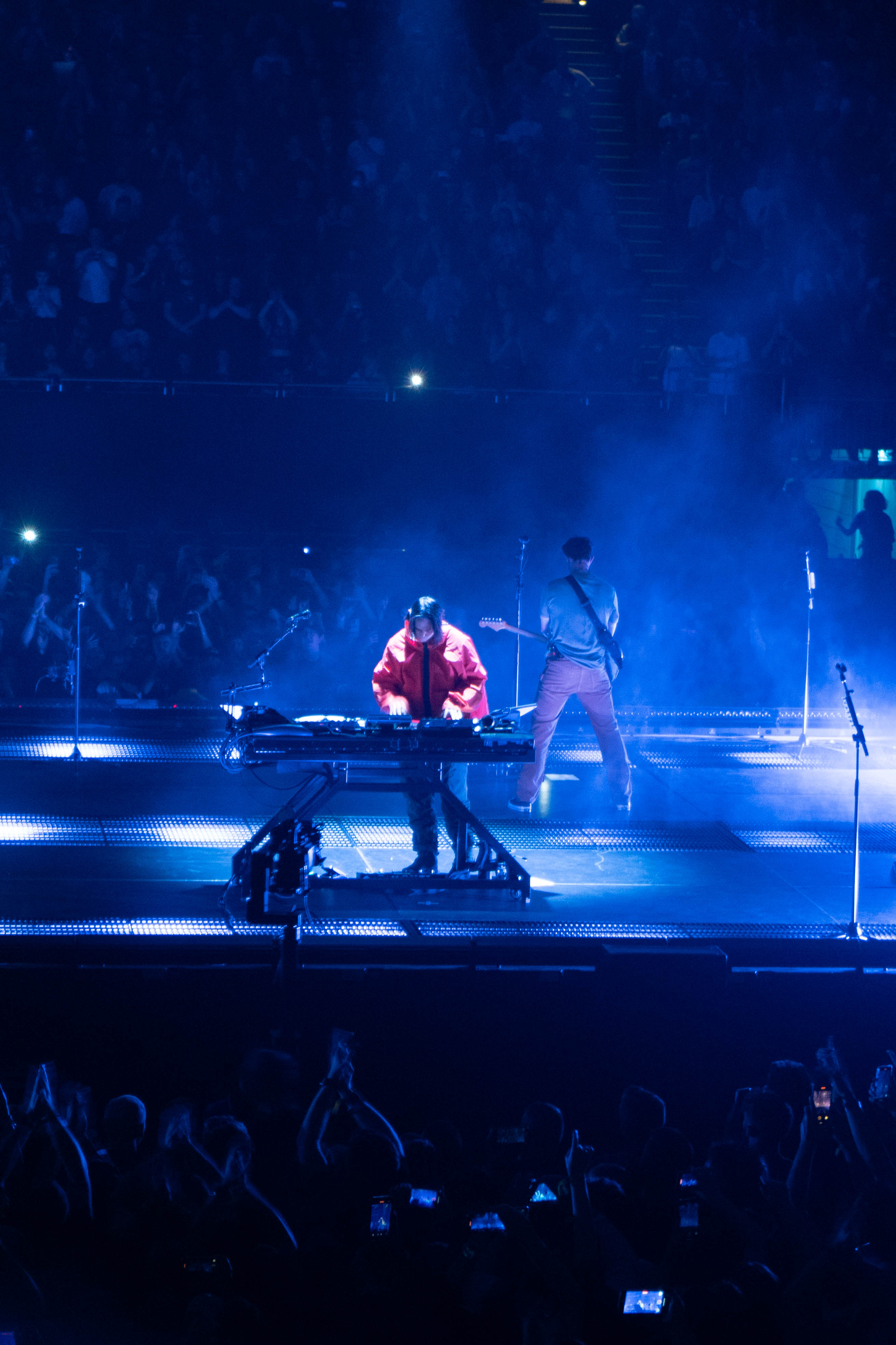 Joe Hann center stage with orange lighting